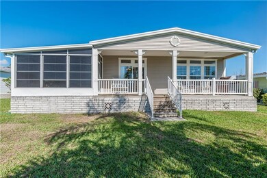 View of rear of home featuring the porch and scree