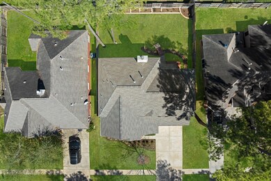 An aerial view shows a beautiful property with plenty of elbow room!