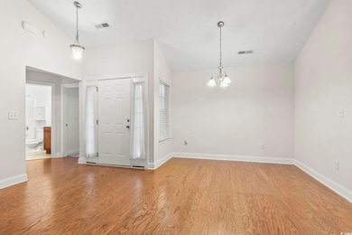 Entryway featuring a chandelier and light wood finished floors