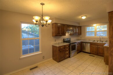 Kitchen with new stainless appliances.