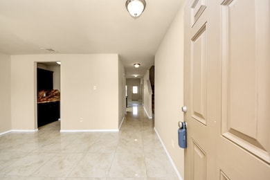 Bright and welcoming, the entryway opens up to hig