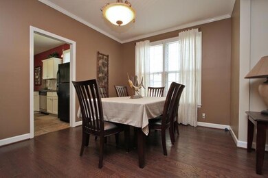 The formal dining room features a window overlooking the side green space and is ready for your next dinner party.