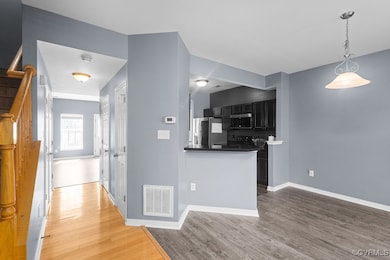 Kitchen featuring stainless steel appliances, ligh