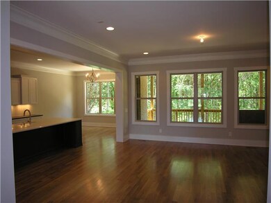 Family room, opens to kitchen, breakfast & rear covered porch.