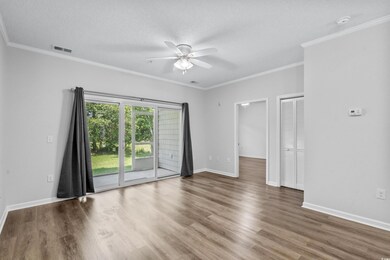 Spare room with a textured ceiling, ceiling fan, w