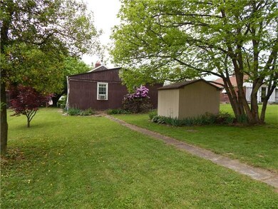 Exterior Back. REAR SHED W/ OFF STREET PARKING VIA