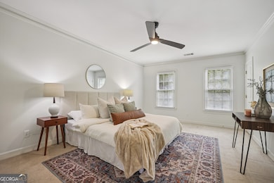 Upstairs, the luxurious Primary Suite feels like a private retreat, showcasing a Walk-In Closet and a beautiful Spa-Style Bath with a 6-foot Picture Window, a large Soaking Tub, and an oversized Double Spa Shower