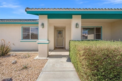 Entrance to property with stucco siding