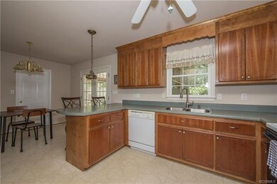 Another view of kitchen and eat-in area.