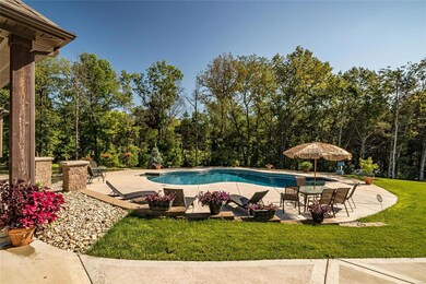 The pool overlooks the 6+ wooded acres with riding