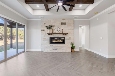 Unfurnished living room with beam ceiling, visibl