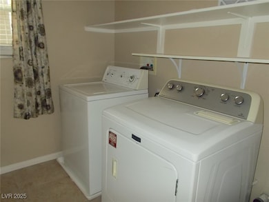 Laundry room with washing machine and dryer and li