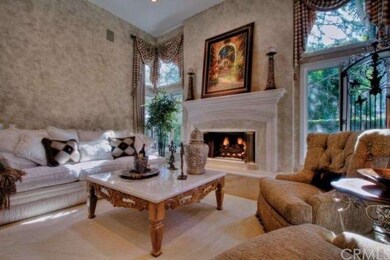 Formal Living Room with elegant, mantled stone fir