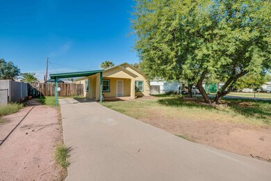 Covered Carport and Paved Driveway