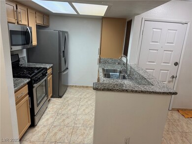 Kitchen featuring a sink, stainless steel applianc