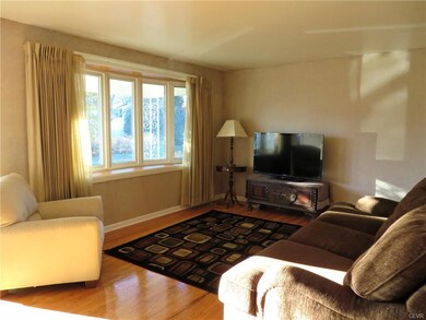 Immaculate hardwood floors greet you and your gues