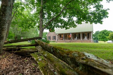 The drive meanders thru the woods and opens up to the house site.. The driveway is shared 