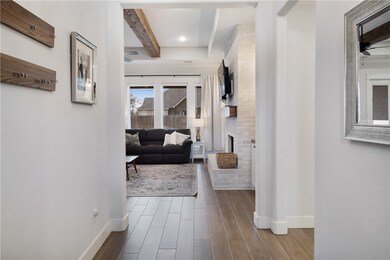 Corridor with recessed lighting, baseboards, beam