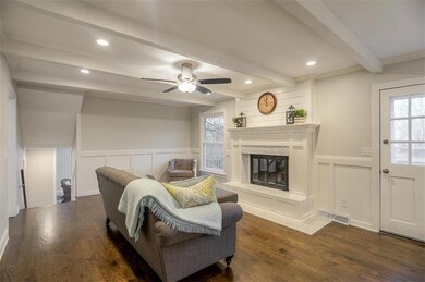 Hearth room! Custom fire place has marble herringb