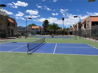 View of tennis court with community basketball cou