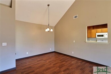 Formal dining area offset from great room