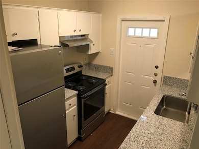 Kitchen with stainless steel appliances, under ca