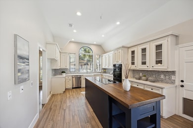 The spacious island with an electric cooktop is pe