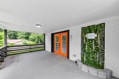 View of patio featuring french doors and a carport