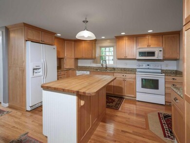 The kitchen features a large...
