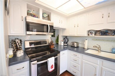 UPDATED KITCHEN WITH NEWER COUNTERTOPS, BACKSPLASH