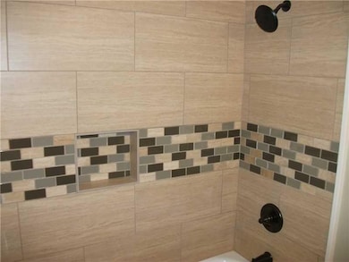 Full Bath. New tile shower surround with oil rubbe