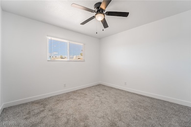 Empty room with baseboards, carpet floors, and cei