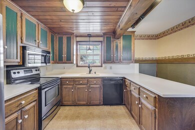 Kitchen featuring light tile patterned floors, a 