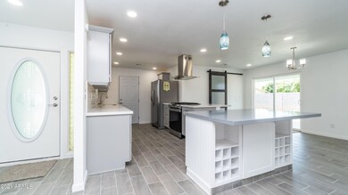 Front door entry and kitchen
