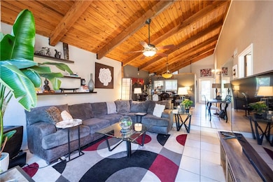This home features vaulted, beam ceilings througho