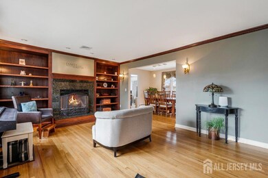 Fireplace in Living Room With Custom Built-In Bookshelves on Both Sides Of Fireplace