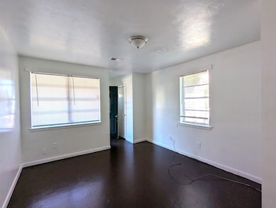 Spare room featuring baseboards and visible vents