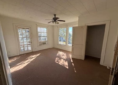 Spare room featuring a ceiling fan