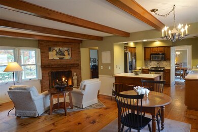Large wide plank pine floors, beamed ceilings, and