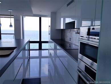 Kitchen view from laundry area and service entranc