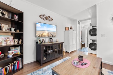 Interior space with baseboards, wood finished floo