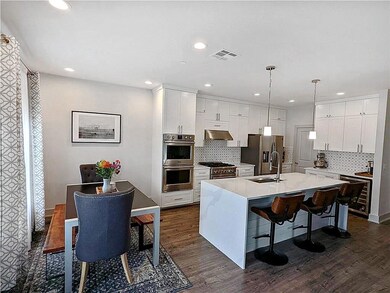 Kitchen featuring appliances with stainless steel