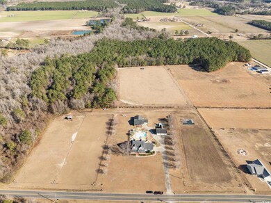 Birds eye view of property featuring a rural view