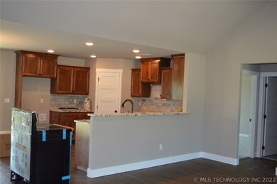 Open kitchen and living room.  Gorgeous granite co