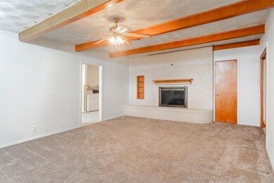 Large living area with fireplace and beautiful woo