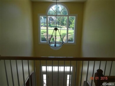 Open foyer with Palladian window overlooking the l