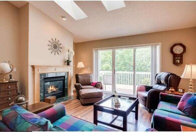 Living room with fireplace and vaulted ceilings