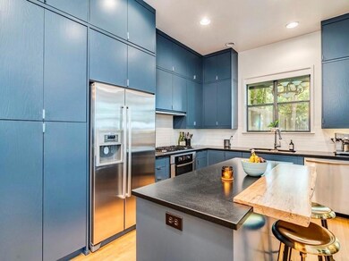 Kitchen featuring appliances with stainless steel