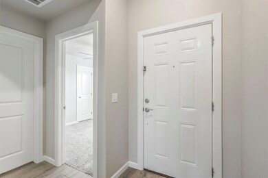 Entryway with light hardwood / wood-style flooring