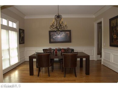 Dining Room. Large formal dining room complete with heavy moldings, chairrail, and picture molding.